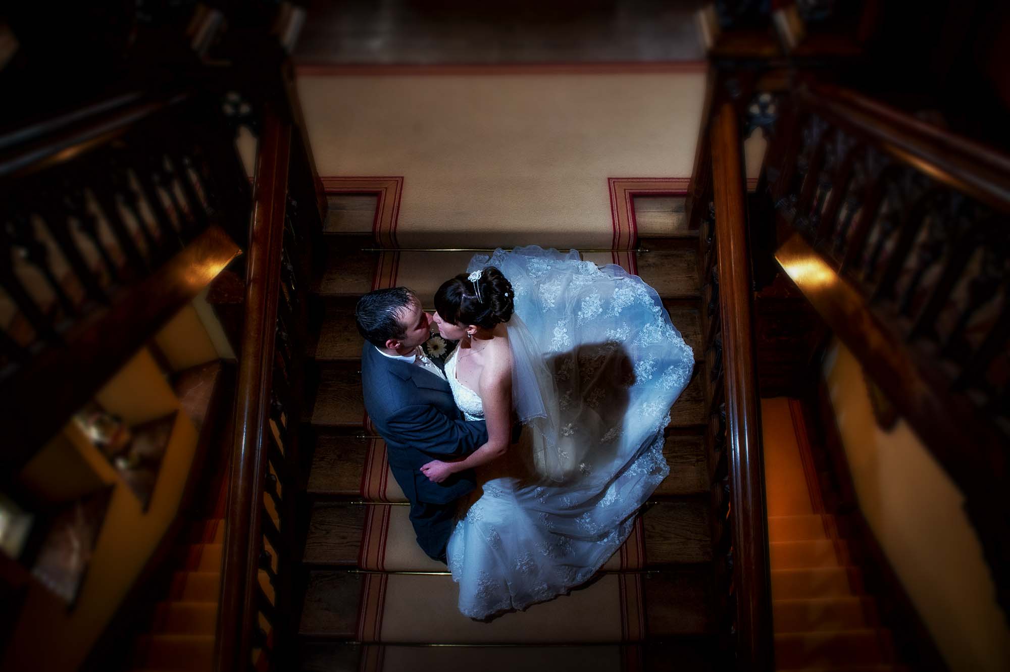 Bride and groom on the stairs at Carlton Towers on their wedding