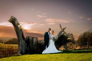 Later afternoon winter sun with bride and groom at WoodHall Hotel